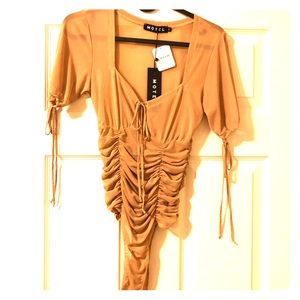 Motel sheer body suit